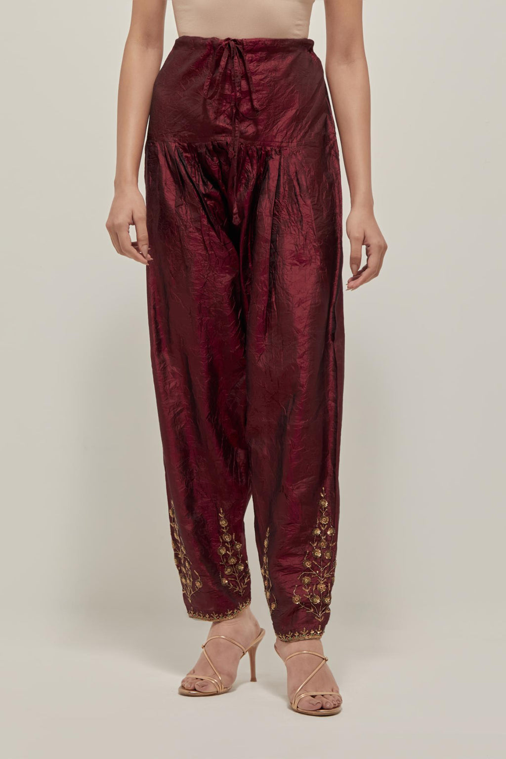 Maroon Silk salwar, highlighted with hand embroidered bead, sequins and zardozi boota at hem, highlighted with contrast bead work.
