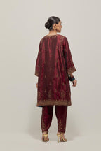 Maroon double toned silk easy fit short kurta set with hand embroidered zardozi and sequins, highlighted with beads.