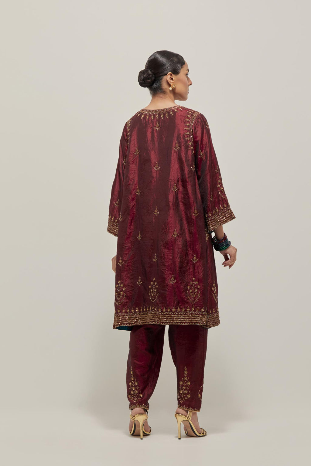 Maroon double toned silk easy fit short kurta set with hand embroidered zardozi and sequins, highlighted with beads.