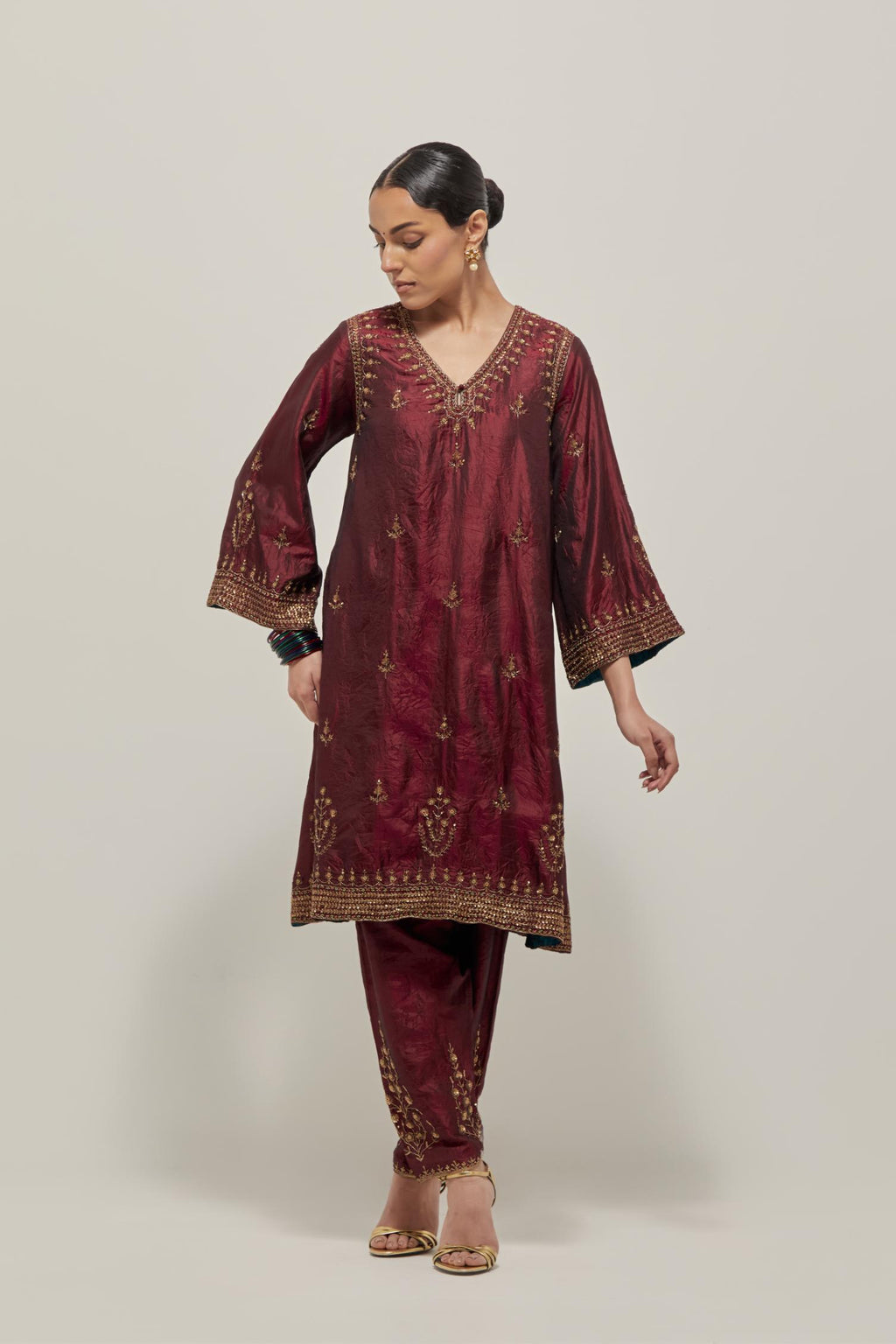 Maroon double toned silk easy fit short kurta set with hand embroidered zardozi and sequins, highlighted with beads.