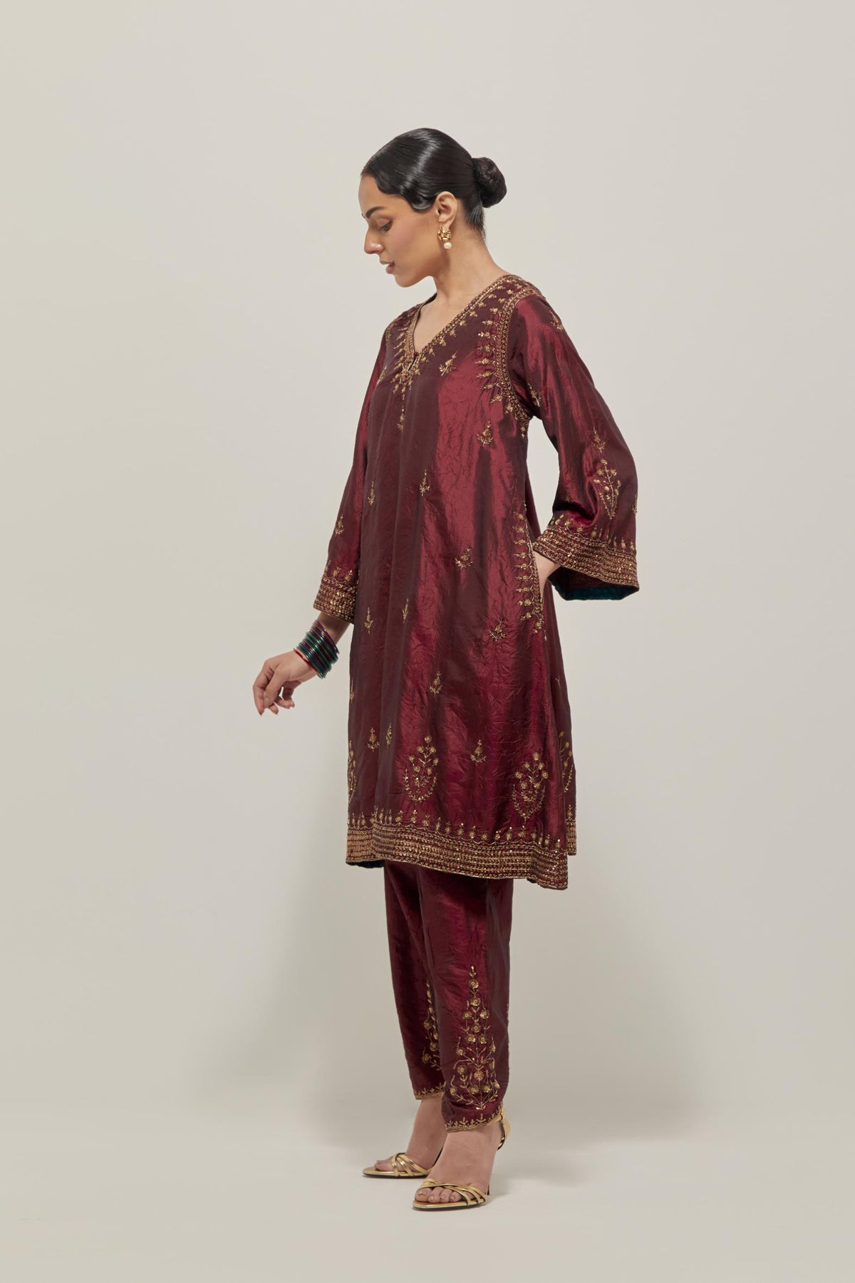 Maroon double toned silk easy fit short kurta set with hand embroidered zardozi and sequins, highlighted with beads.
