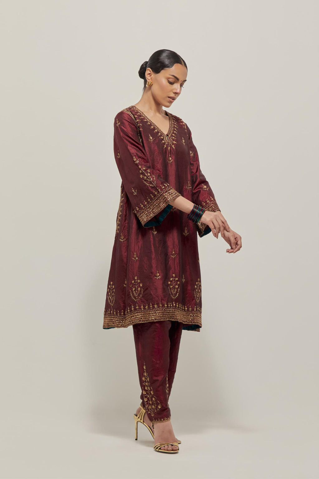 Maroon double toned silk easy fit short kurta set with hand embroidered zardozi and sequins, highlighted with beads.