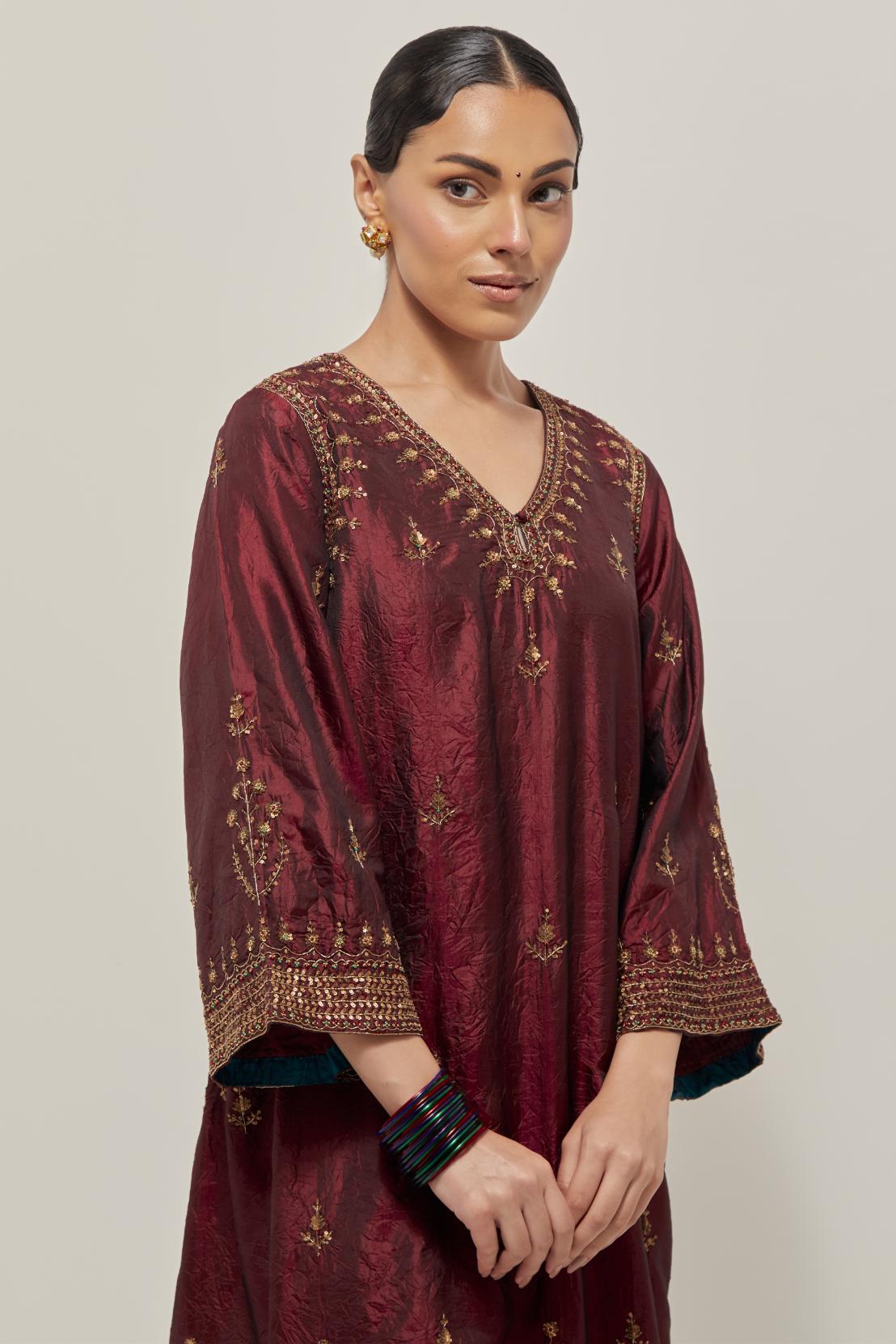 Maroon double toned silk easy fit short kurta set with hand embroidered zardozi and sequins, highlighted with beads.