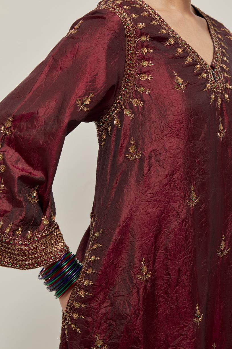 Maroon double toned silk easy fit short kurta set with hand embroidered zardozi and sequins, highlighted with beads.