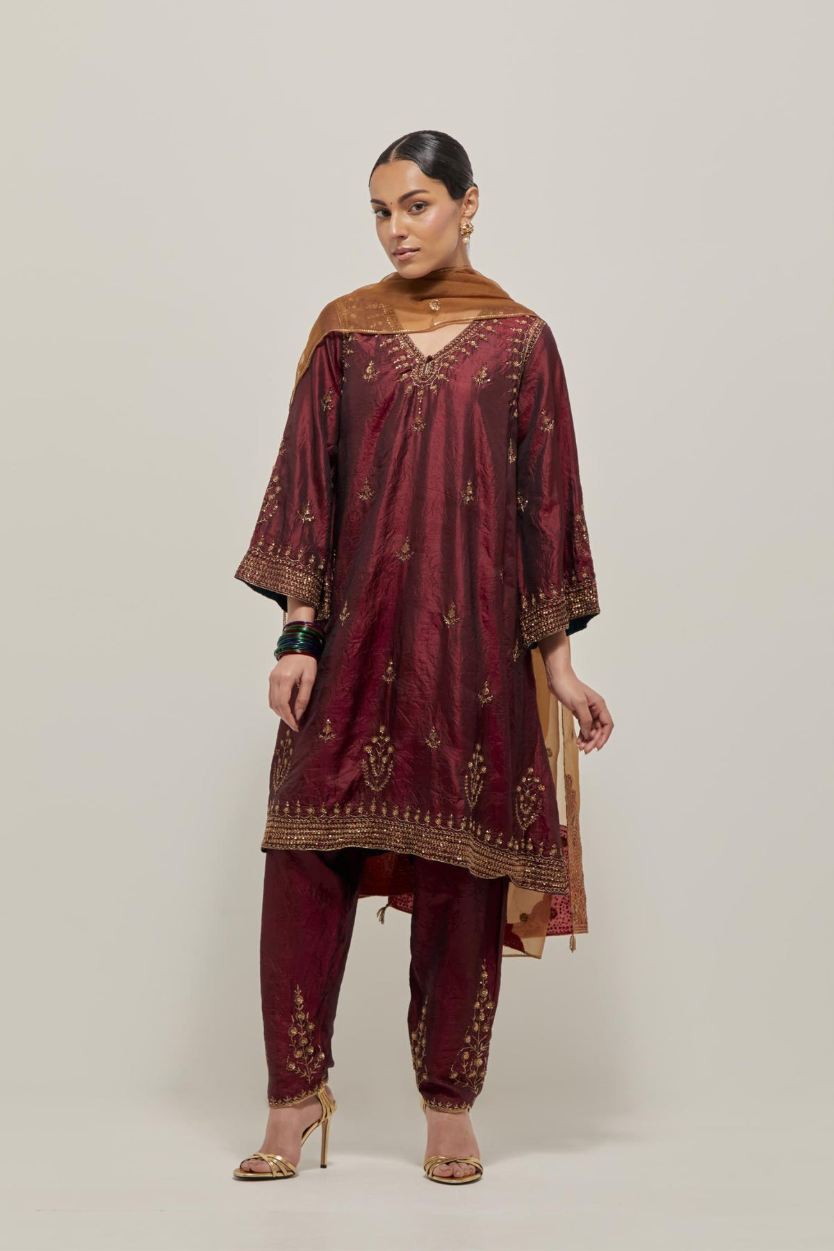 Maroon double toned silk easy fit short kurta set with hand embroidered zardozi and sequins, highlighted with beads.