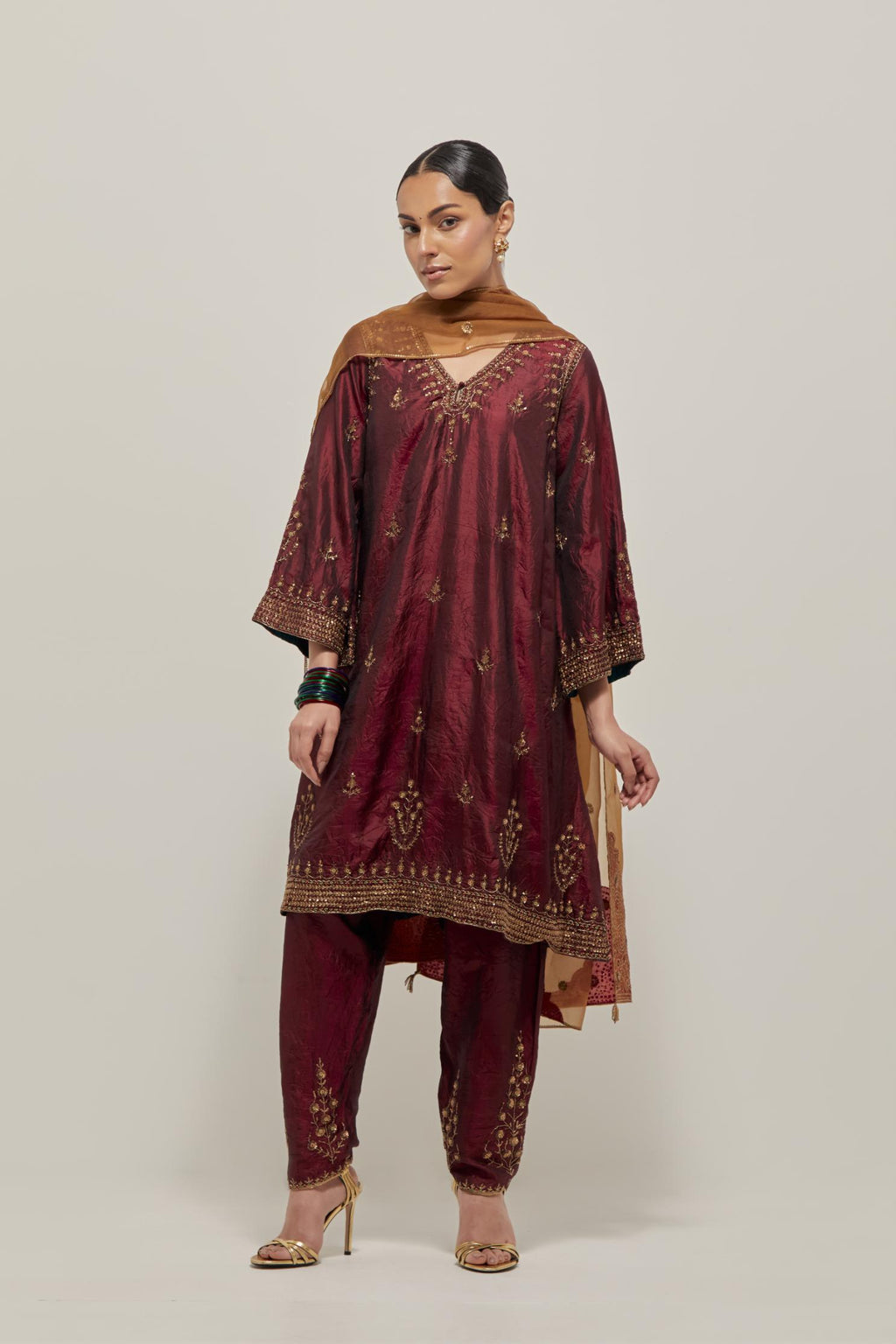 Maroon double toned silk easy fit short kurta set with hand embroidered zardozi and sequins, highlighted with beads.