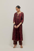 Marron double toned silk Kurta set dress with all-over hand embroidered zardozi and sequins, highlighted with beads.