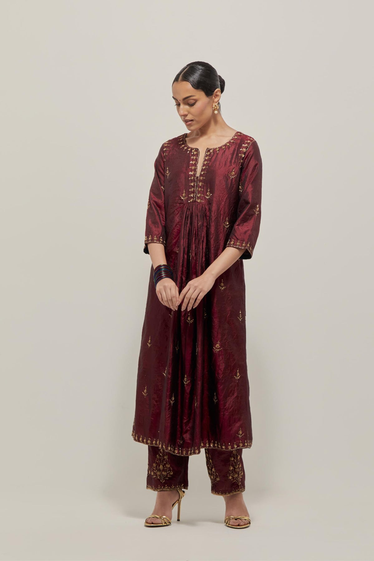Marron double toned silk Kurta set dress with all-over hand embroidered zardozi and sequins, highlighted with beads.