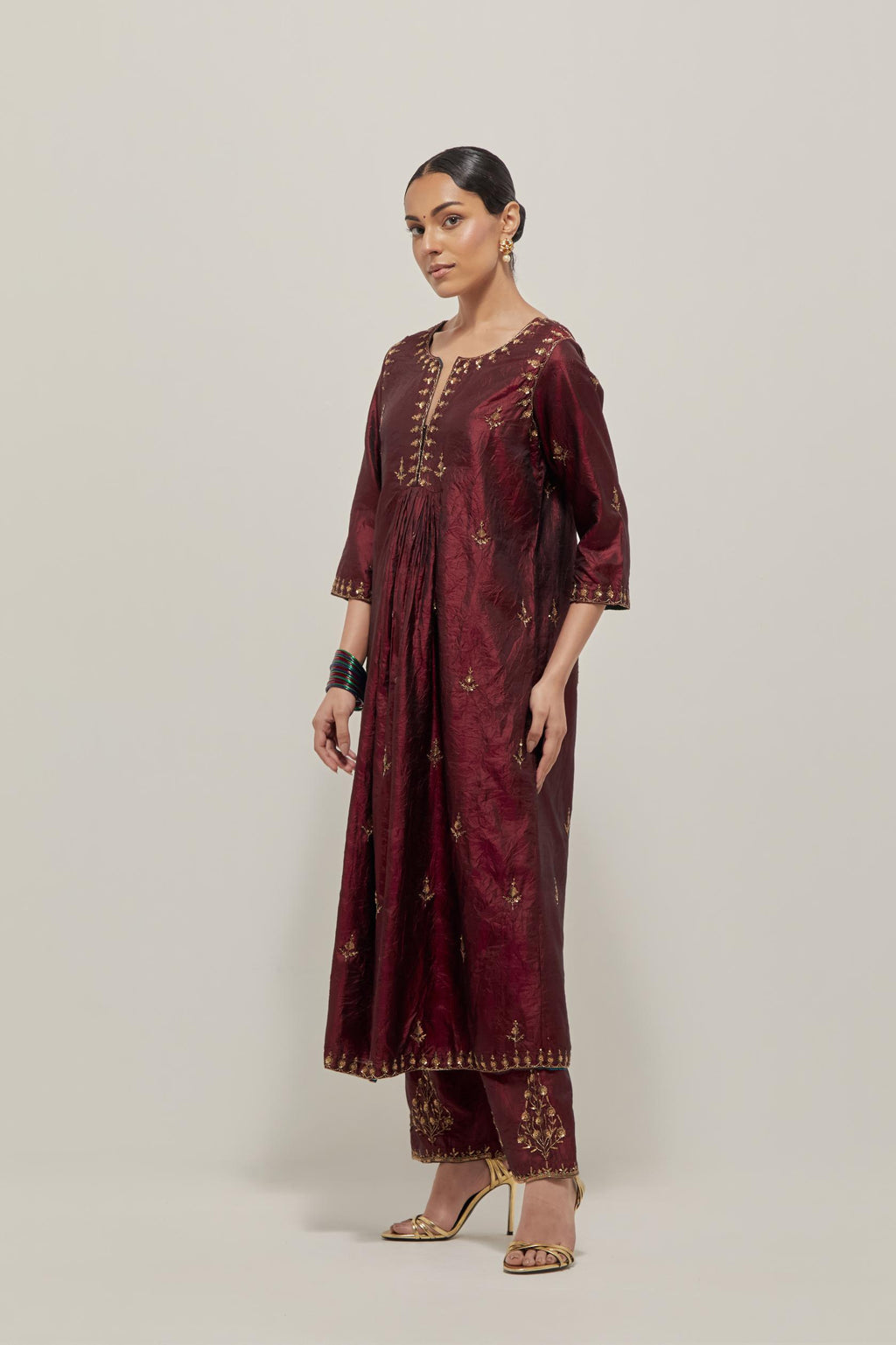 Marron double toned silk Kurta set dress with all-over hand embroidered zardozi and sequins, highlighted with beads.