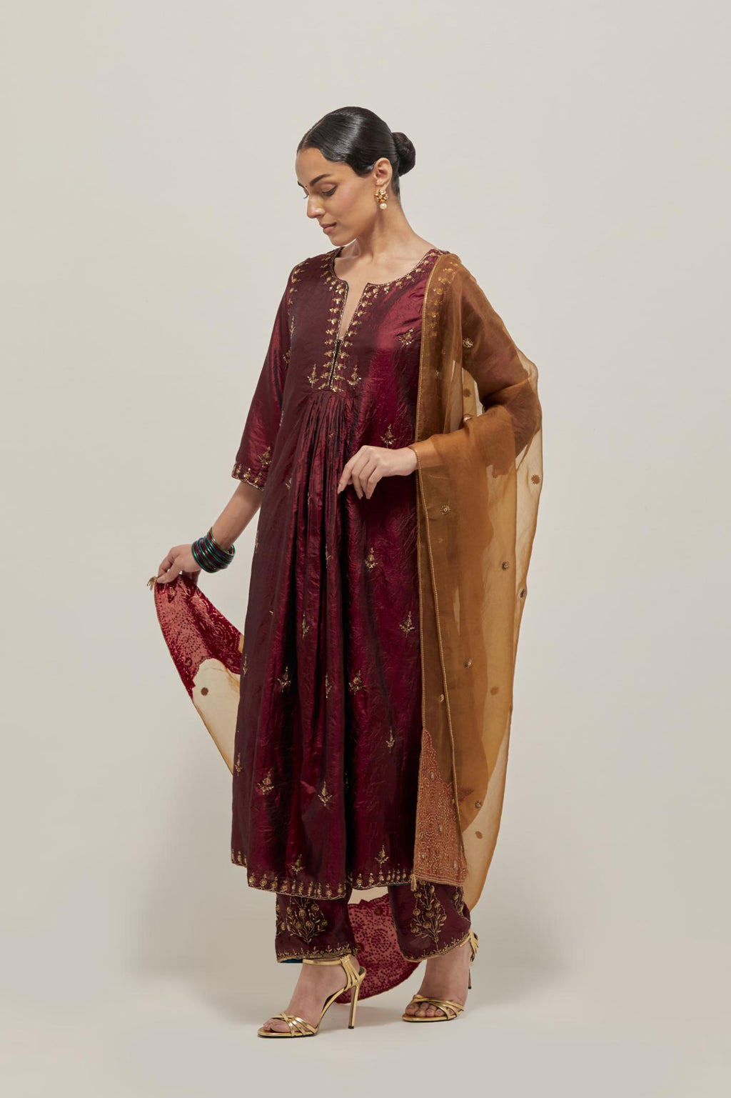 Marron double toned silk Kurta set dress with all-over hand embroidered zardozi and sequins, highlighted with beads.