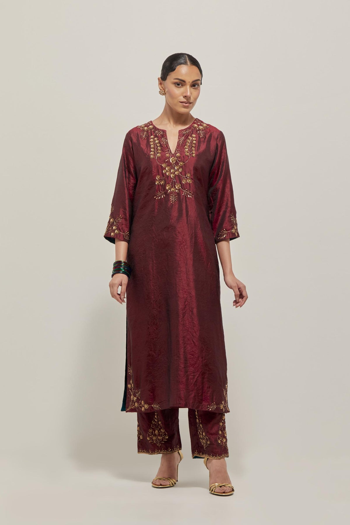 Maroon double toned silk straight Kurta set with hand embroidered zardozi and sequins, highlighted with beads.