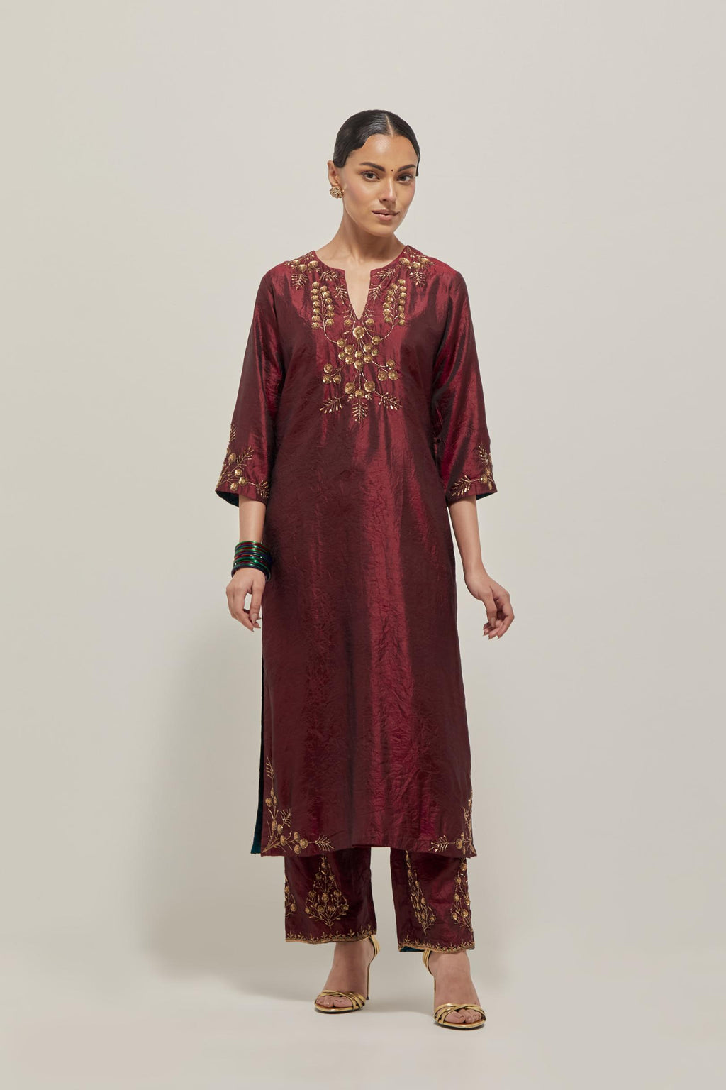 Maroon double toned silk straight Kurta set with hand embroidered zardozi and sequins, highlighted with beads.