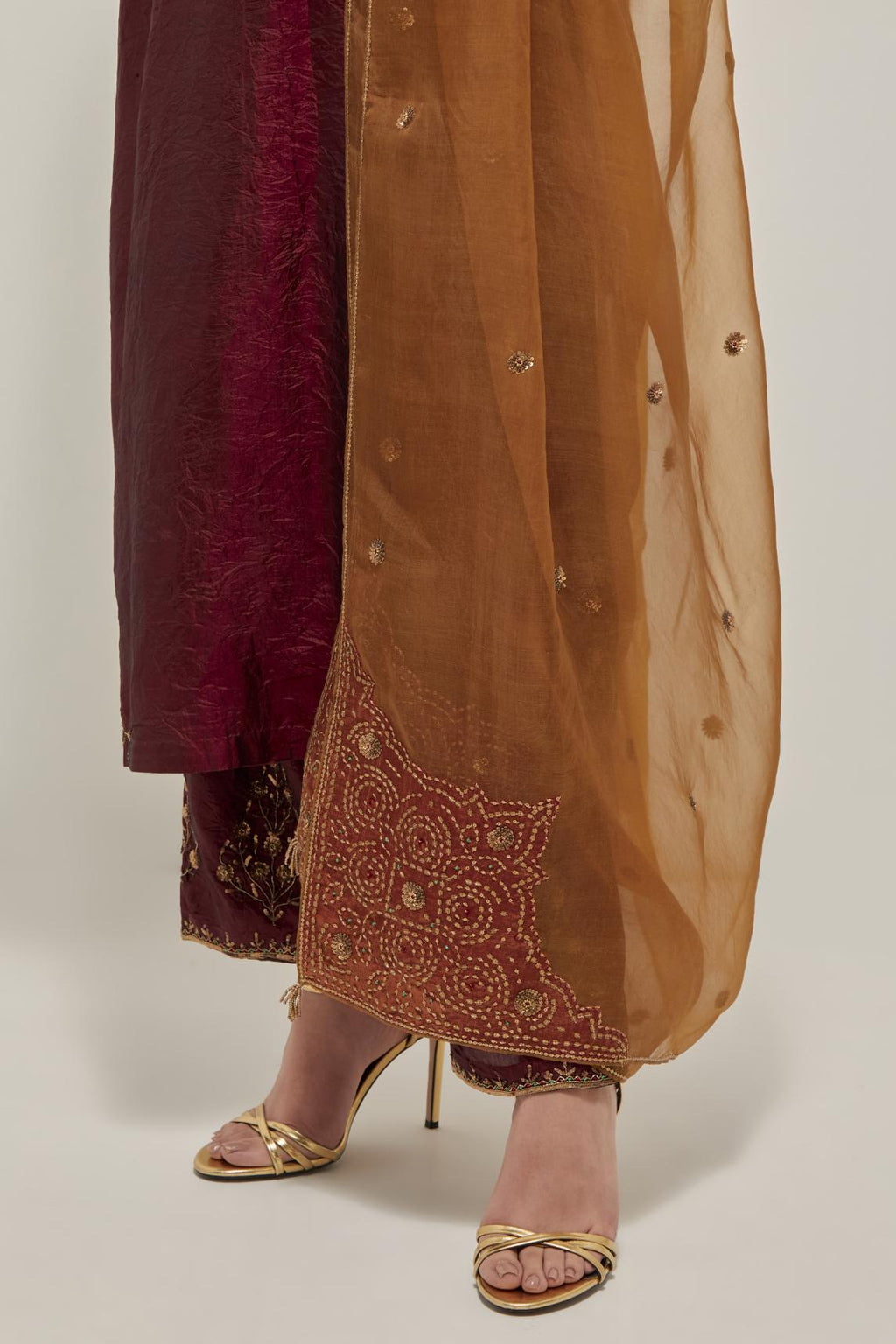 Maroon double toned silk straight Kurta set with hand embroidered zardozi and sequins, highlighted with beads.