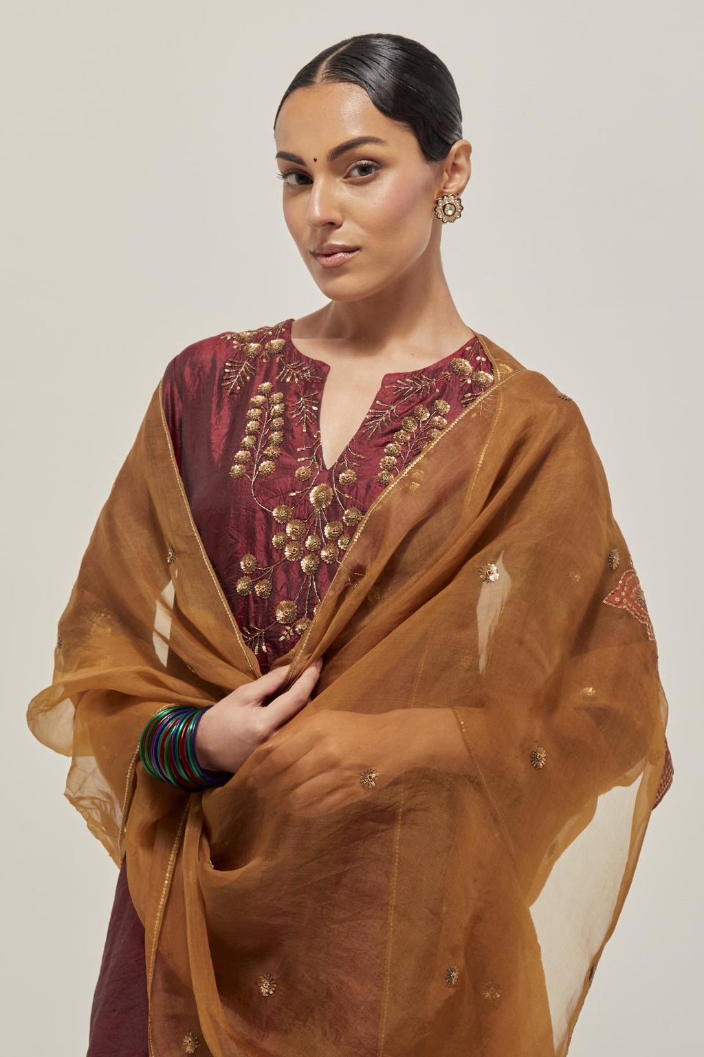 Maroon double toned silk straight Kurta set with hand embroidered zardozi and sequins, highlighted with beads.