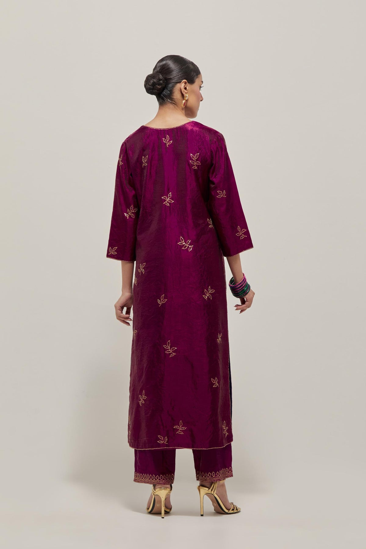 Wine Silk kurta set with hand embroidered sequins on bandhani inspired floral motif all-over the kurta, highlighted with contrast-colored beads.