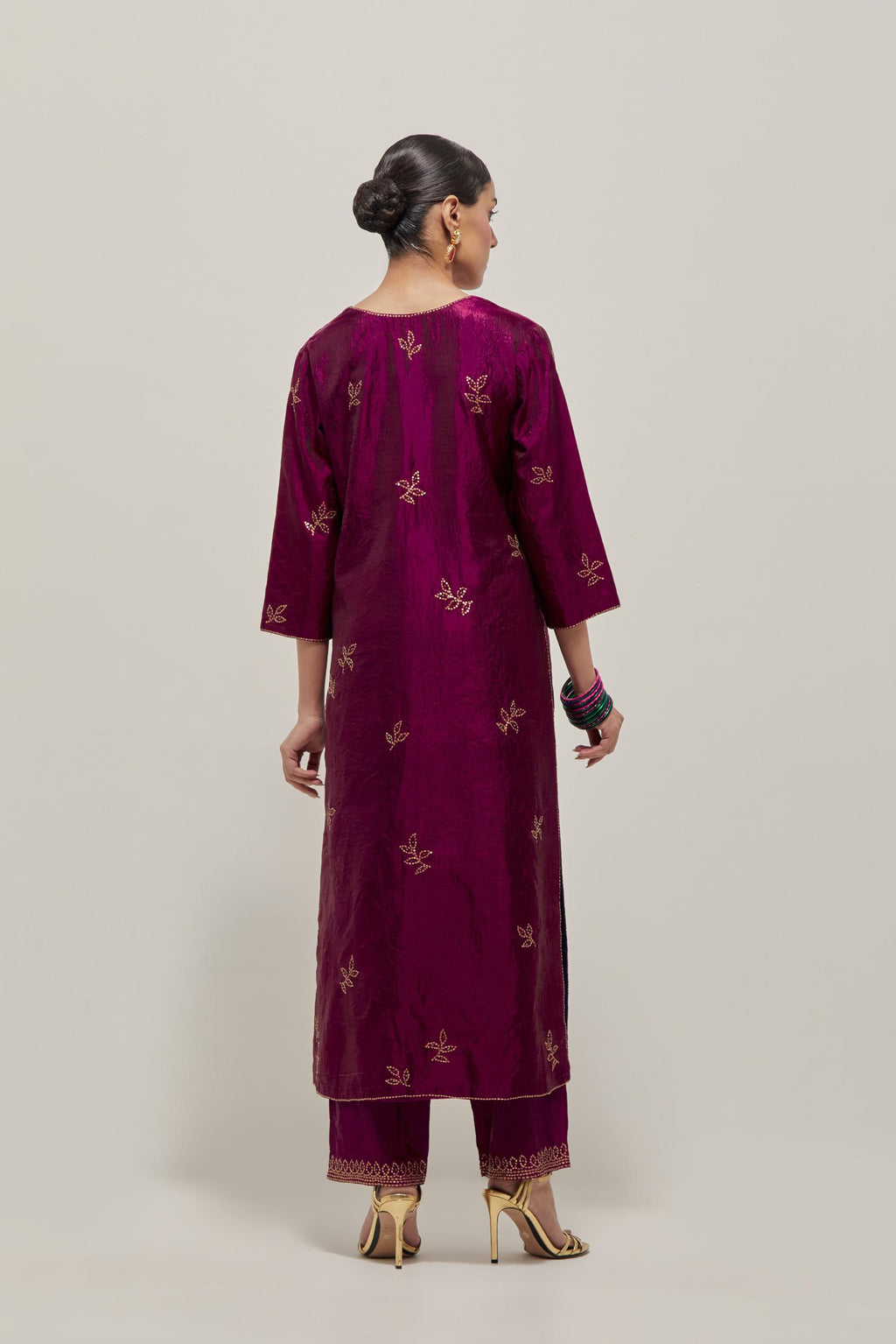 Wine Silk kurta set with hand embroidered sequins on bandhani inspired floral motif all-over the kurta, highlighted with contrast-colored beads.