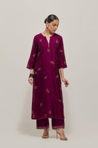 Wine Silk kurta set with hand embroidered sequins on bandhani inspired floral motif all-over the kurta, highlighted with contrast-colored beads.
