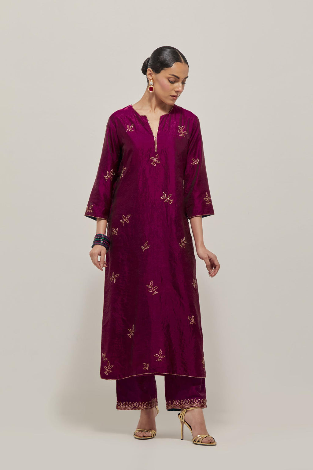 Wine Silk kurta set with hand embroidered sequins on bandhani inspired floral motif all-over the kurta, highlighted with contrast-colored beads.