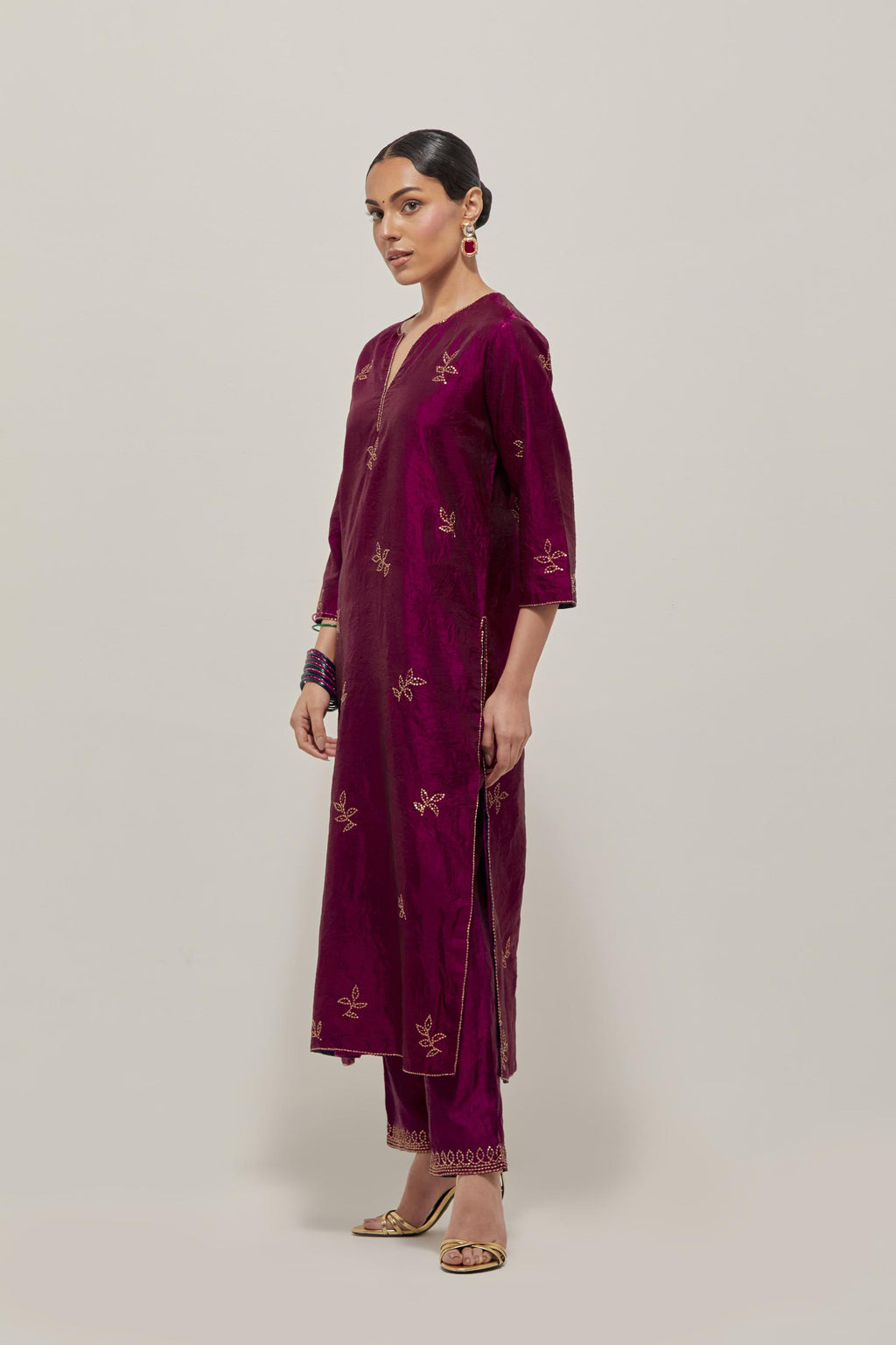 Wine Silk kurta set with hand embroidered sequins on bandhani inspired floral motif all-over the kurta, highlighted with contrast-colored beads.