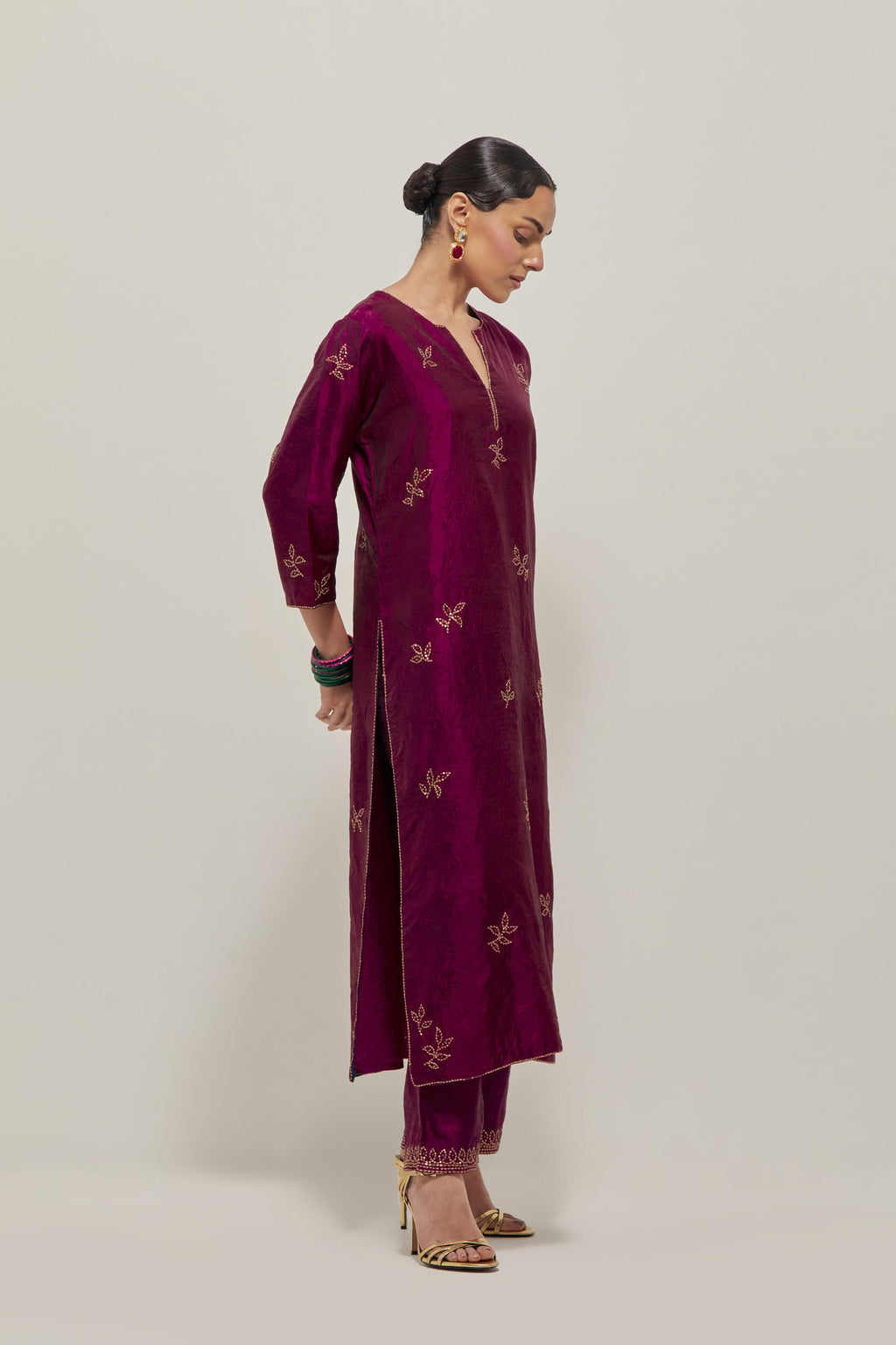 Wine Silk kurta set with hand embroidered sequins on bandhani inspired floral motif all-over the kurta, highlighted with contrast-colored beads.