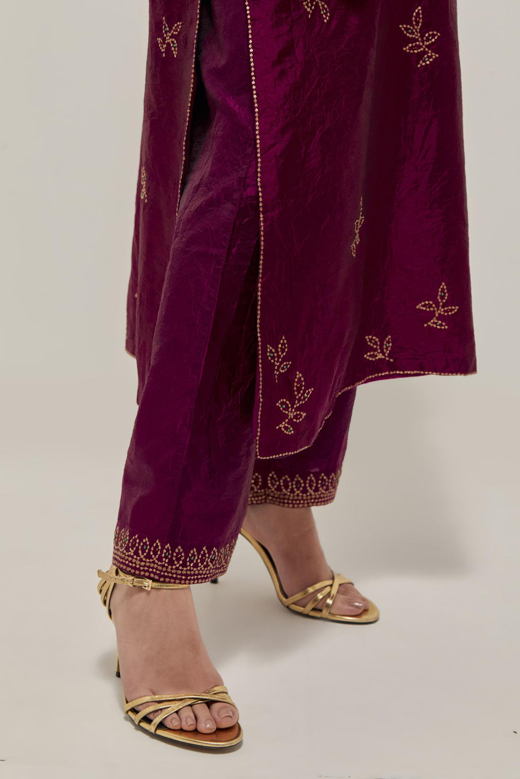 Wine Silk kurta set with hand embroidered sequins on bandhani inspired floral motif all-over the kurta, highlighted with contrast-colored beads.