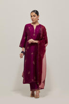 Wine Silk kurta set with hand embroidered sequins on bandhani inspired floral motif all-over the kurta, highlighted with contrast-colored beads.