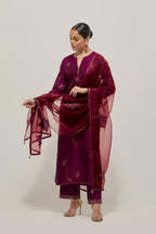 Wine Silk kurta set with hand embroidered sequins on bandhani inspired floral motif all-over the kurta, highlighted with contrast-colored beads.