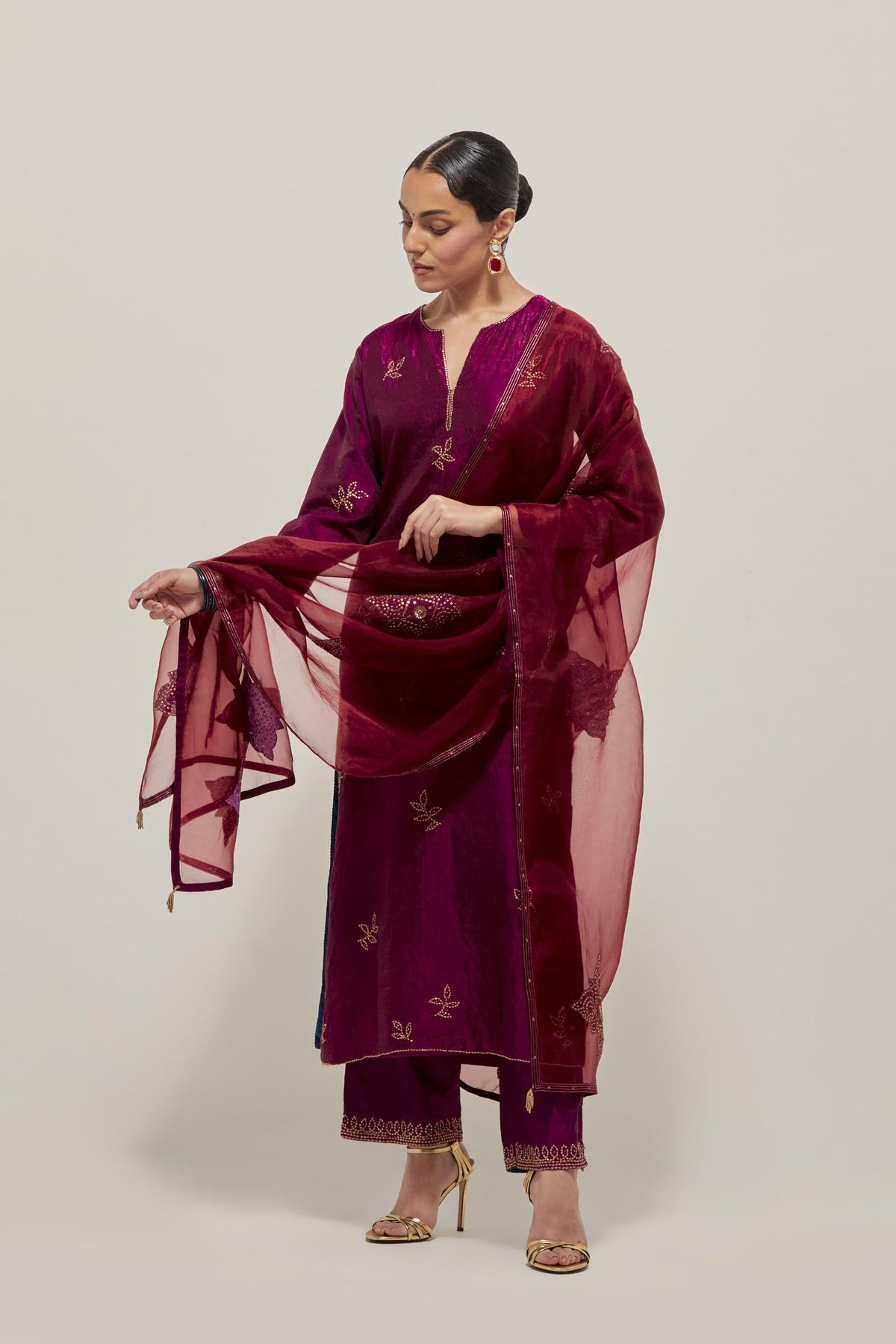 Wine Silk kurta set with hand embroidered sequins on bandhani inspired floral motif all-over the kurta, highlighted with contrast-colored beads.