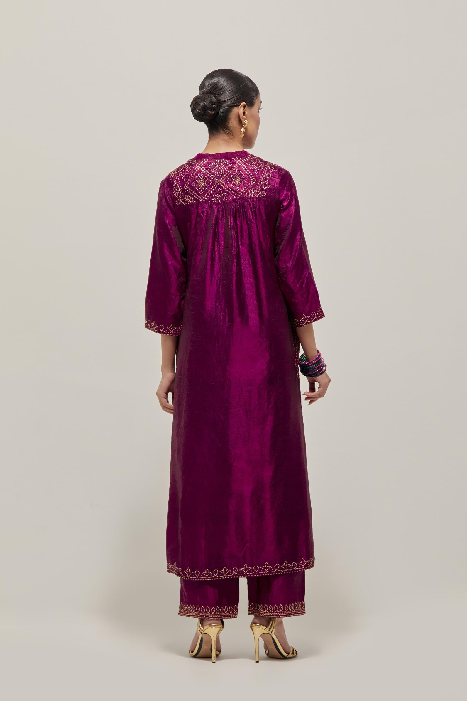 Wine Silk kurta dress set  with hand embroidered sequins on bandhani inspired jaal work at neck, hem and sleeves cuff, highlighted with contrast-colored beads.