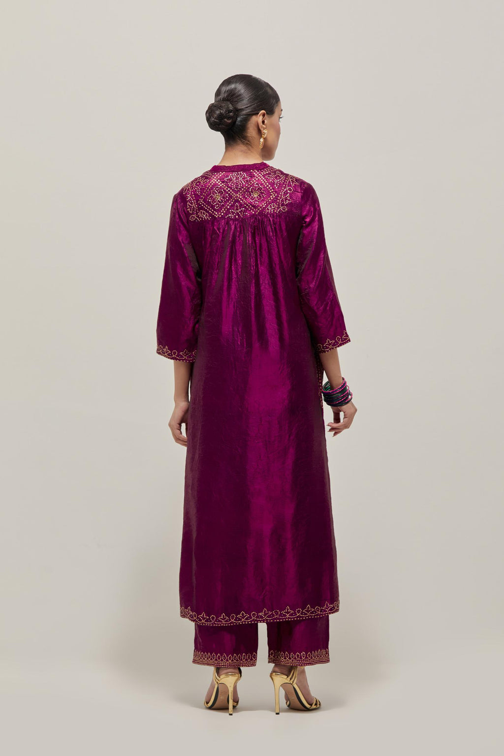 Purple Silk kurta dress set  with hand embroidered sequins on bandhani inspired jaal work at neck, hem and sleeves cuff, highlighted with contrast-colored beads.