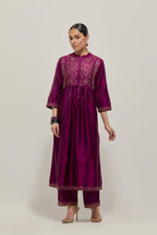 Wine Silk kurta dress set  with hand embroidered sequins on bandhani inspired jaal work at neck, hem and sleeves cuff, highlighted with contrast-colored beads.