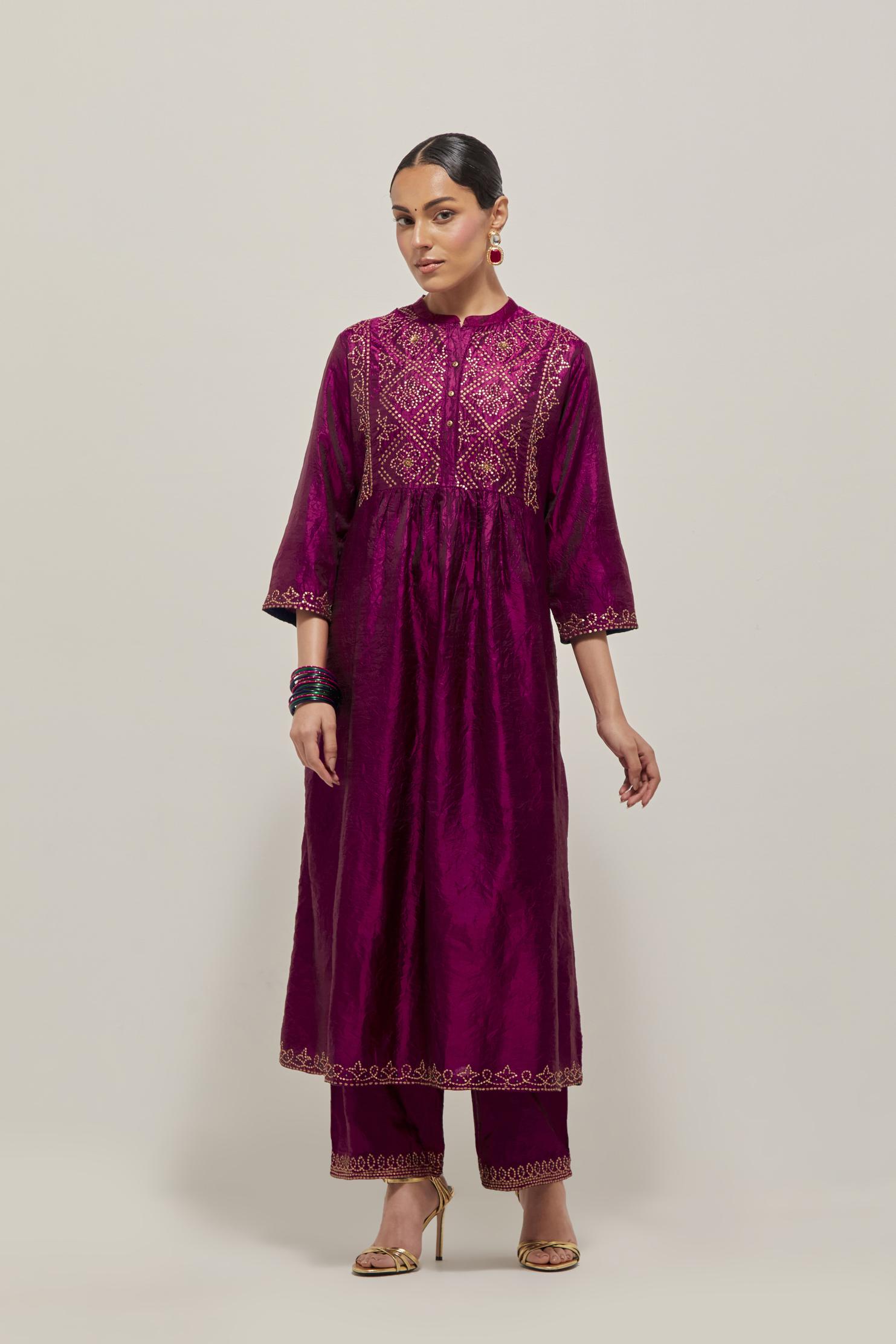 Wine Silk kurta dress set  with hand embroidered sequins on bandhani inspired jaal work at neck, hem and sleeves cuff, highlighted with contrast-colored beads.