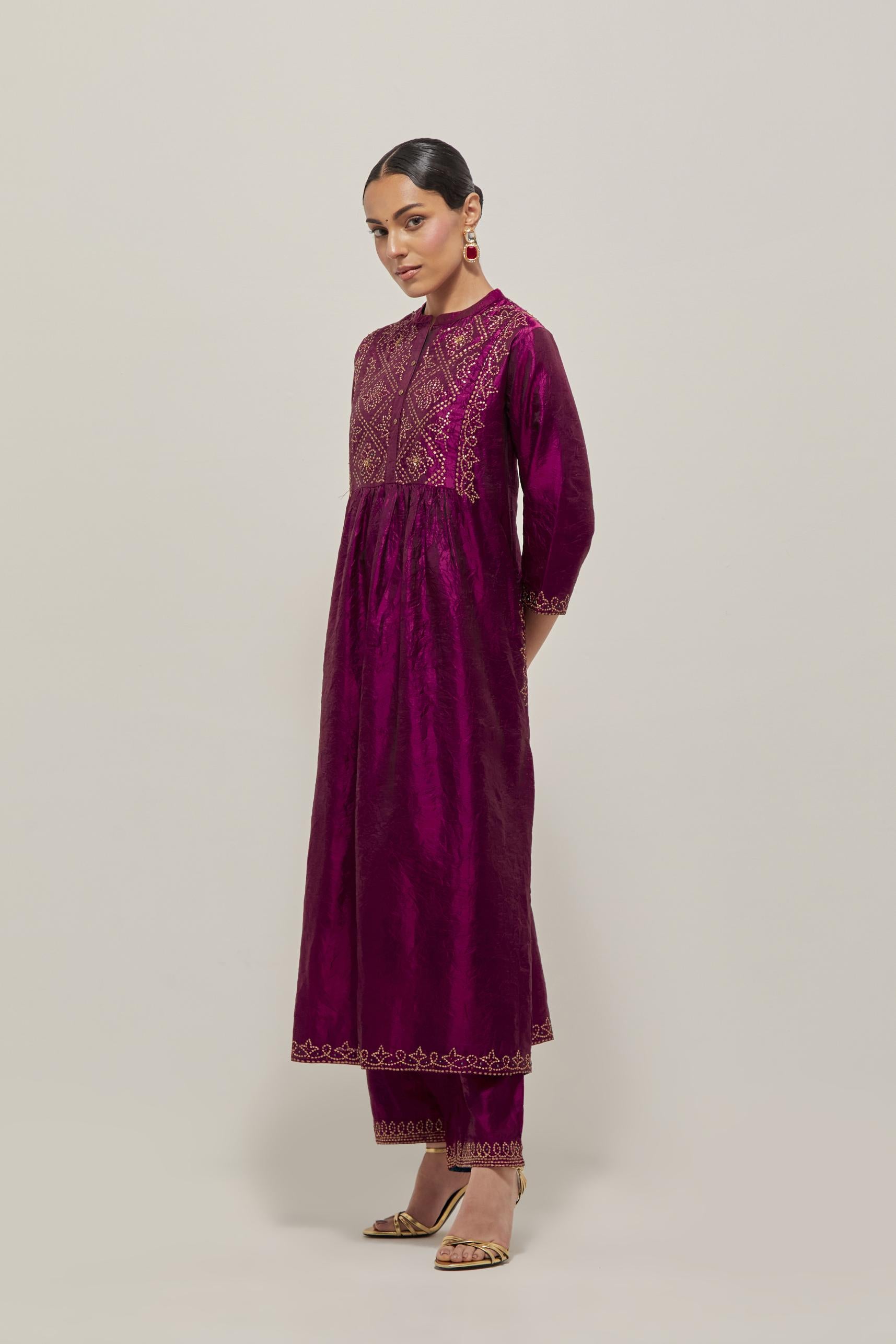 Wine Silk kurta dress set  with hand embroidered sequins on bandhani inspired jaal work at neck, hem and sleeves cuff, highlighted with contrast-colored beads.
