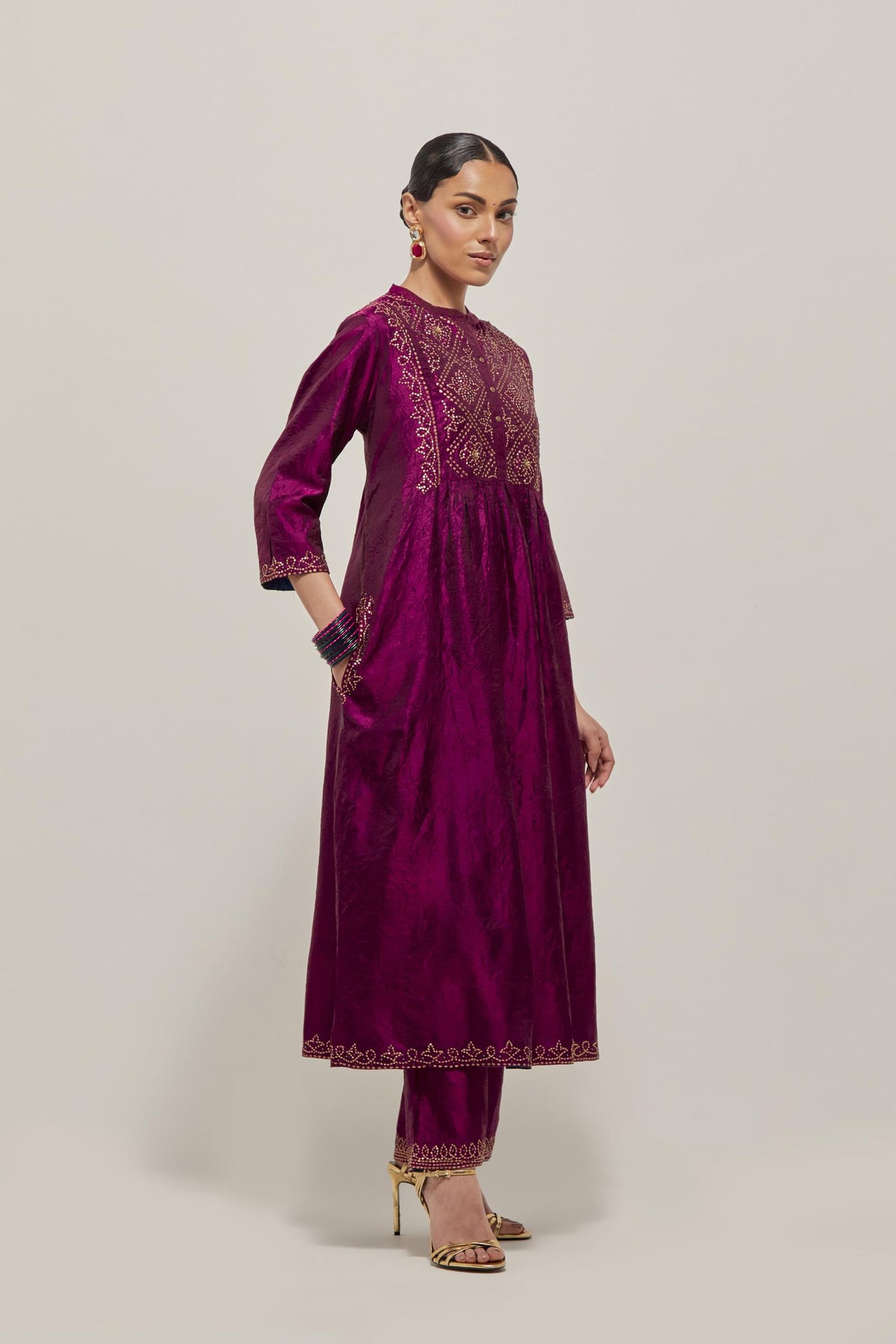 Wine Silk kurta dress set  with hand embroidered sequins on bandhani inspired jaal work at neck, hem and sleeves cuff, highlighted with contrast-colored beads.