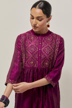 Wine Silk kurta dress set  with hand embroidered sequins on bandhani inspired jaal work at neck, hem and sleeves cuff, highlighted with contrast-colored beads.