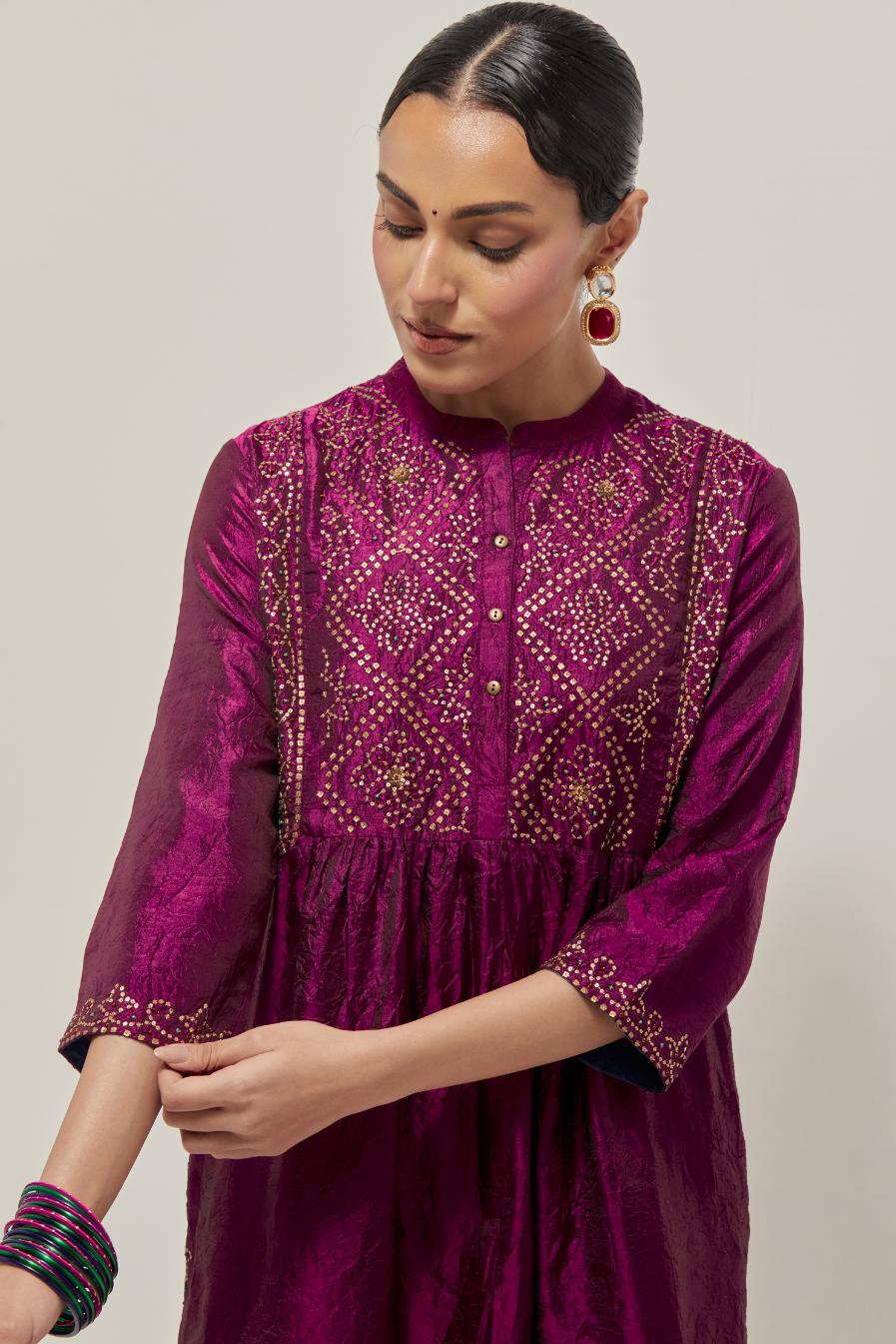 Wine Silk kurta dress set  with hand embroidered sequins on bandhani inspired jaal work at neck, hem and sleeves cuff, highlighted with contrast-colored beads.