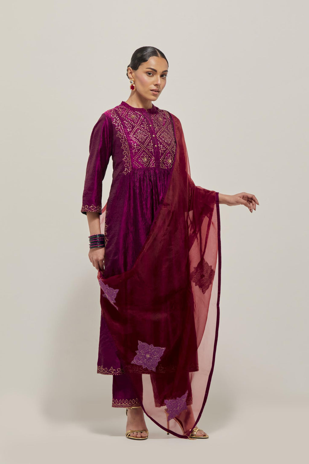 Wine Silk kurta dress set  with hand embroidered sequins on bandhani inspired jaal work at neck, hem and sleeves cuff, highlighted with contrast-colored beads.