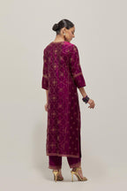 Wine Silk kurta set with all-over hand embroidered sequins on bandhani inspired floral jaal and small square booti at side panels, highlighted with contrast-colored beads.