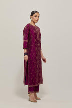 Wine Silk kurta set with all-over hand embroidered sequins on bandhani inspired floral jaal and small square booti at side panels, highlighted with contrast-colored beads.
