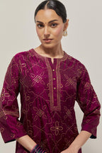 Wine Silk kurta set with all-over hand embroidered sequins on bandhani inspired floral jaal and small square booti at side panels, highlighted with contrast-colored beads.