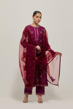 Wine Silk kurta set with all-over hand embroidered sequins on bandhani inspired floral jaal and small square booti at side panels, highlighted with contrast-colored beads.