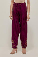 Wine Silk salwar, highlighted with hand embroidered bead, sequins and zardozi boota at hem, highlighted with contrast bead work.