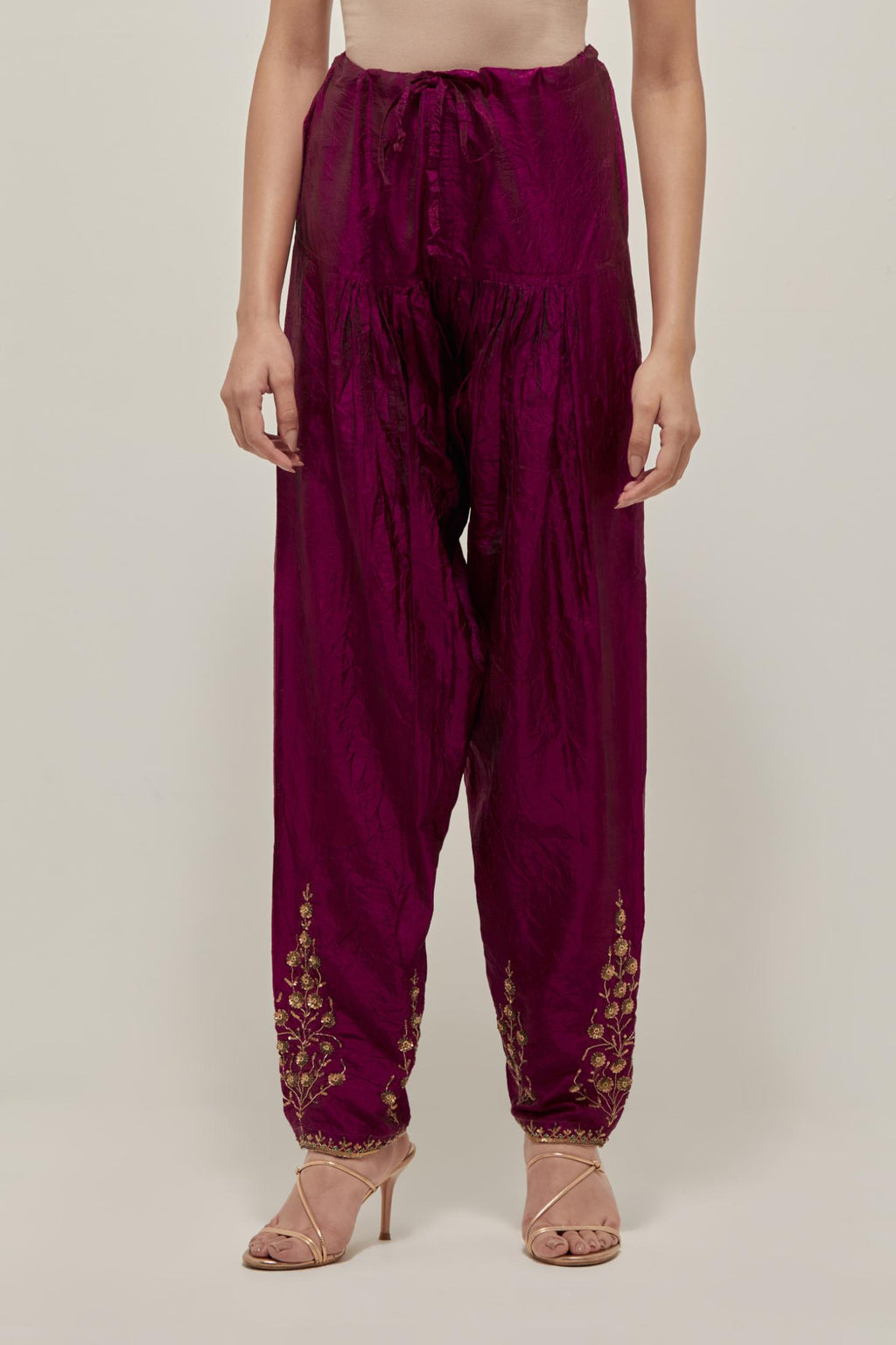 Wine Silk salwar, highlighted with hand embroidered bead, sequins and zardozi boota at hem, highlighted with contrast bead work.