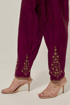 Wine Silk salwar, highlighted with hand embroidered bead, sequins and zardozi boota at hem, highlighted with contrast bead work.