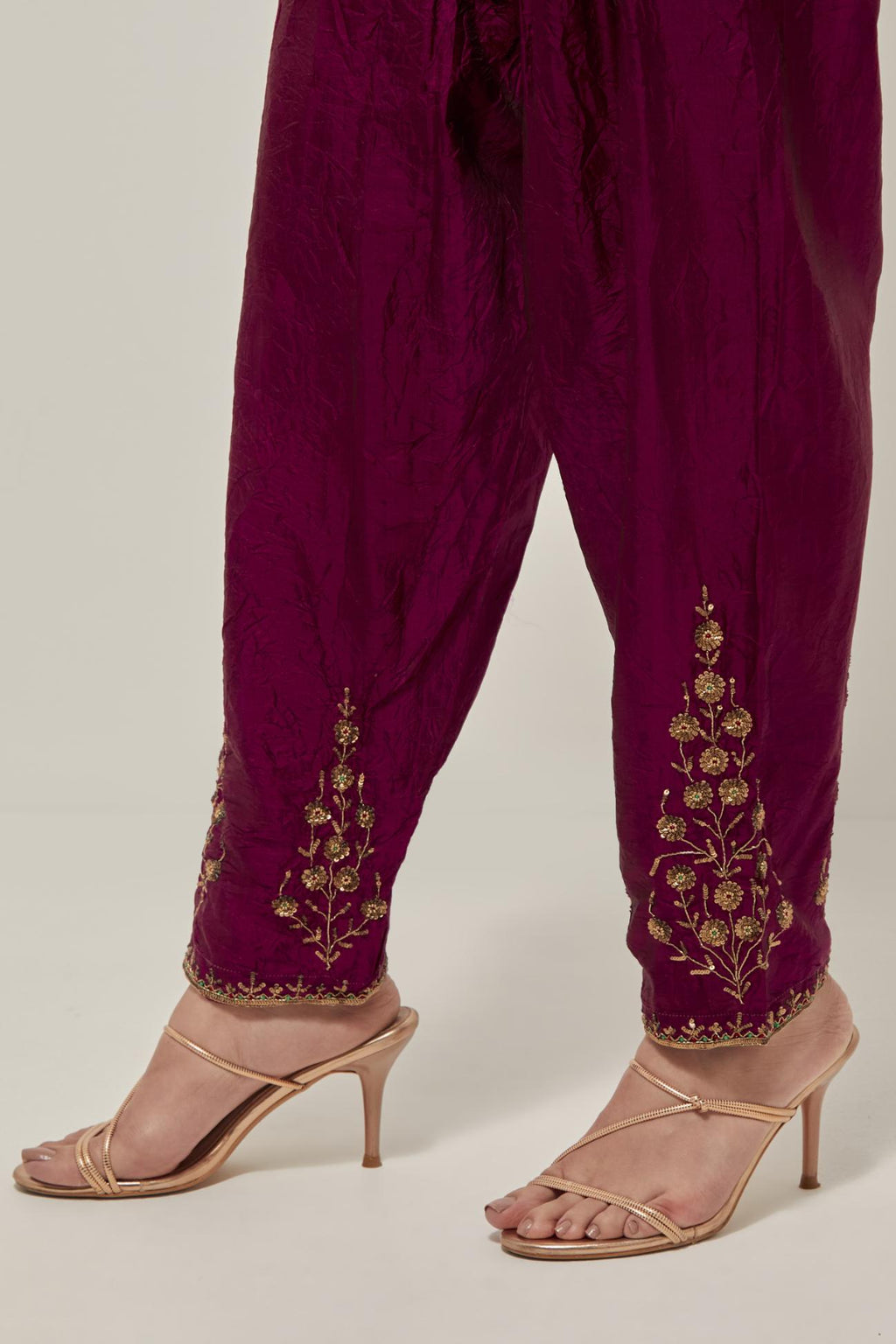 Wine Silk salwar, highlighted with hand embroidered bead, sequins and zardozi boota at hem, highlighted with contrast bead work.