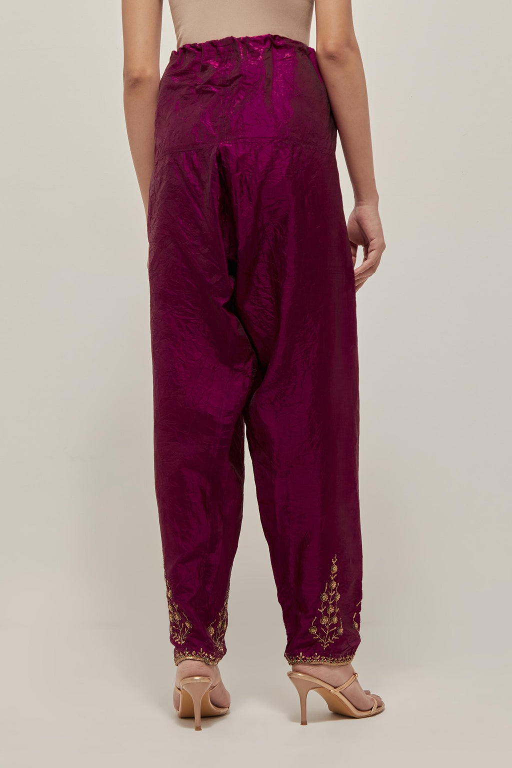 Wine Silk salwar, highlighted with hand embroidered bead, sequins and zardozi boota at hem, highlighted with contrast bead work.