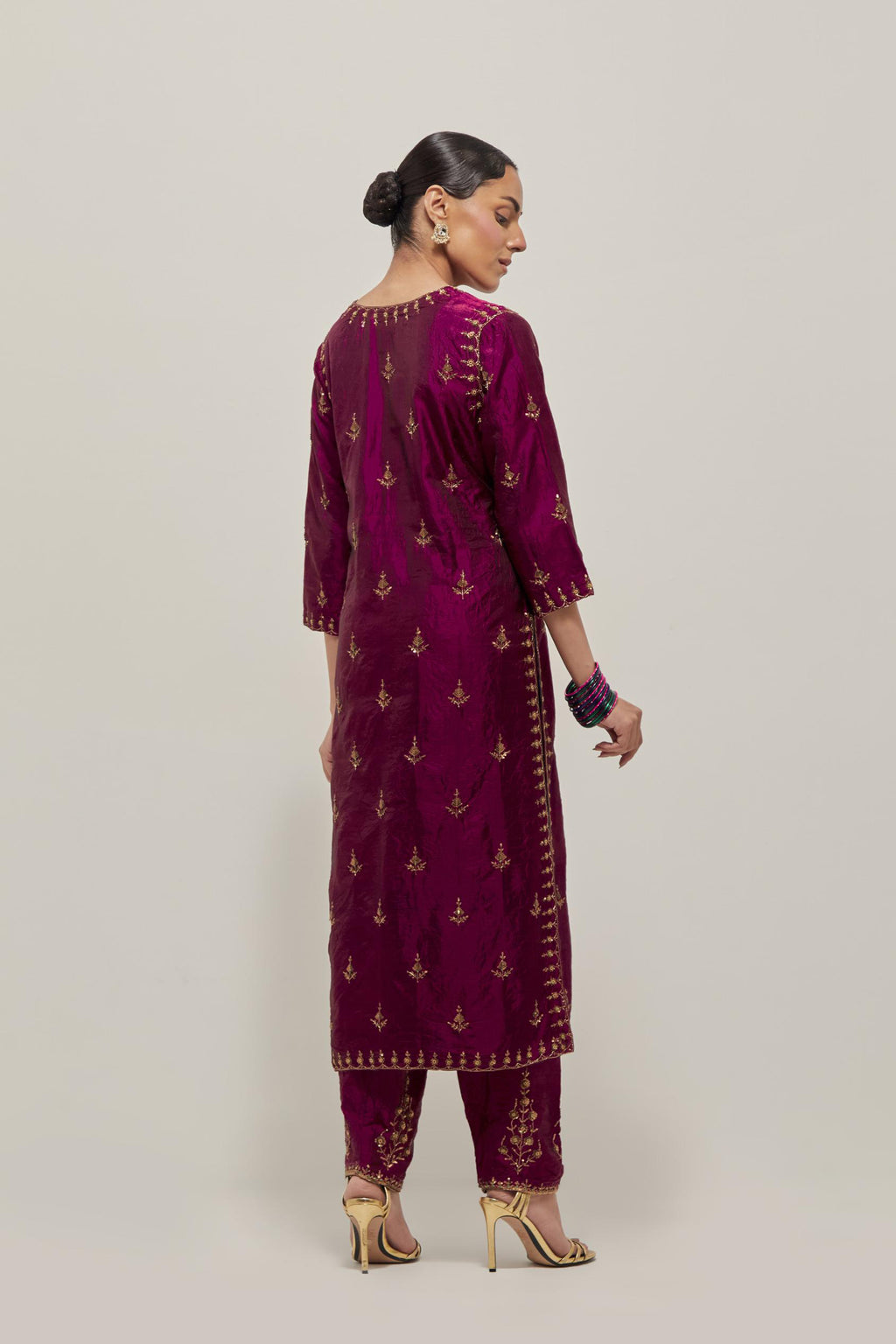 Wine double toned silk straight kurta with all-over hand embroidered zardozi and sequins work, highlighted with beads.