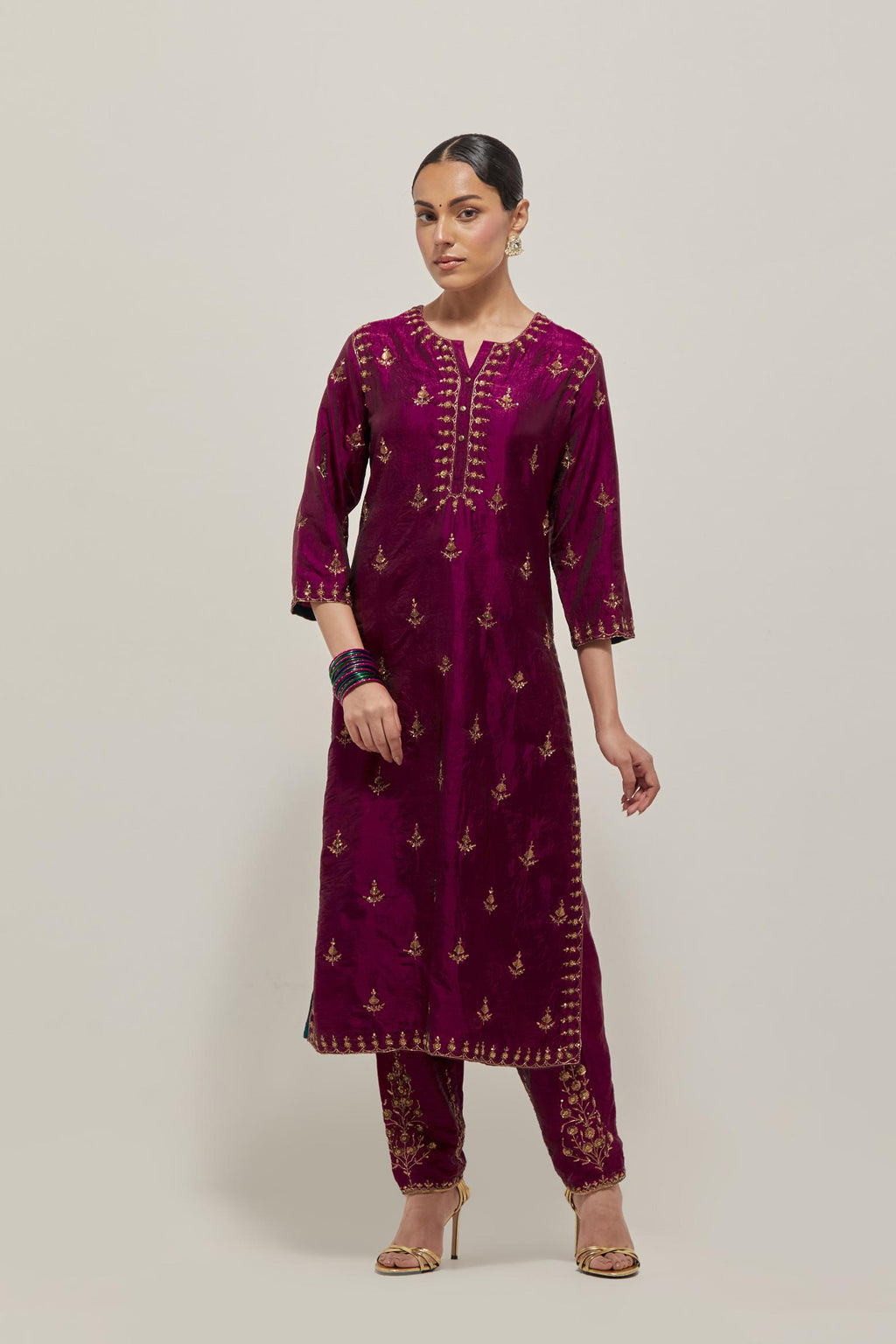 Wine double toned silk straight kurta with all-over hand embroidered zardozi and sequins work, highlighted with beads.