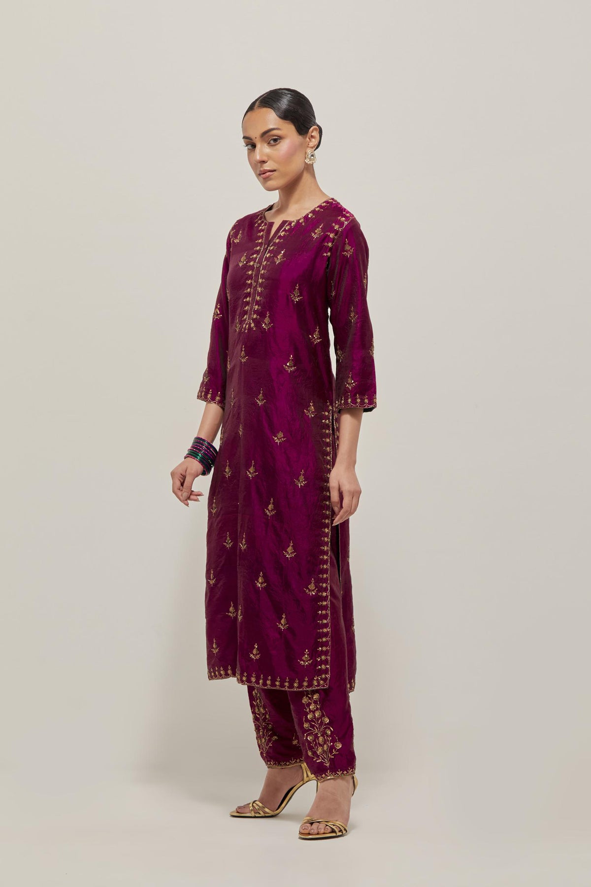 Wine double toned silk straight kurta with all-over hand embroidered zardozi and sequins work, highlighted with beads.