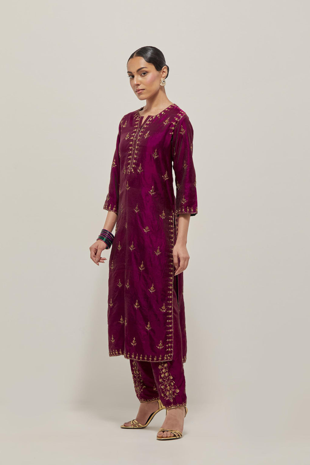 Wine double toned silk straight kurta with all-over hand embroidered zardozi and sequins work, highlighted with beads.